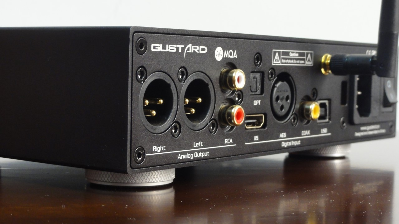 Illustrative image of the rear panel of a dedicated desktop DAC and its connections.